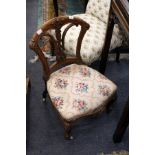 A Victorian walnut low bedroom chair