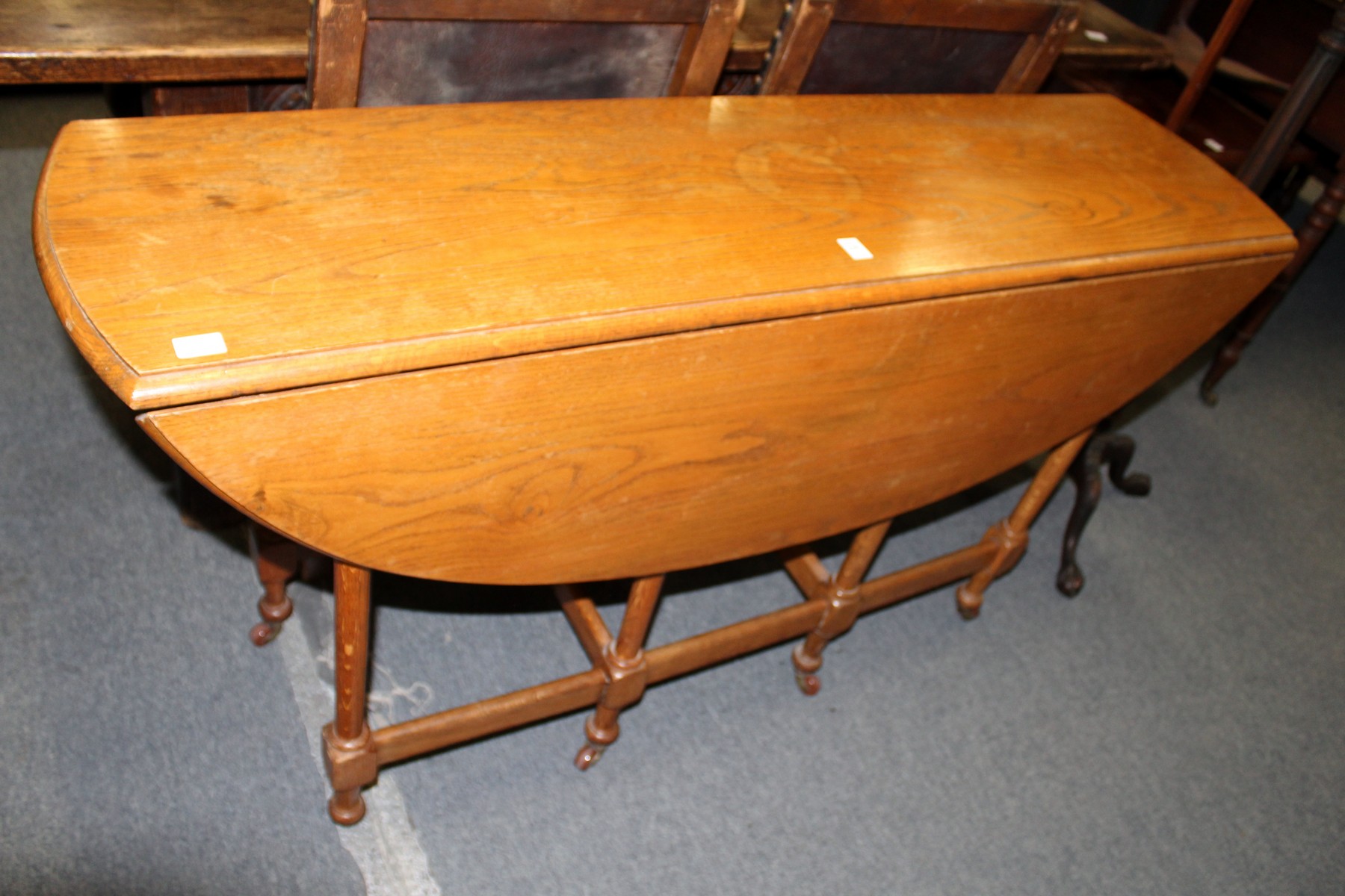 A Wake style oak drop leaf gateleg dining table