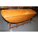 A Wake style oak drop leaf gateleg dining table