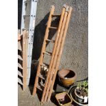 A small wooden three section ladder