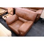 An Italian brown leather upholstered armchair