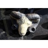 A pottery wall pocket modelled as a rams head