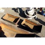 A pair of cast iron troughs
