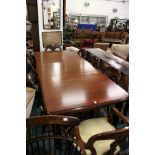 A good Victorian style mahogany extending dining table with one extra leaf on turned and reeded