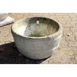 A barrel shaped reconstituted stone planter