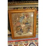 A woolwork tapestry picture in a maple frame