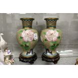 A pair of Chinese cloisonne vases on stands