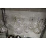 A quantity of cut glass decanters