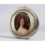 A good circular silver box the cover with oval portrait plaque of a young lady