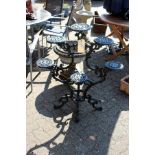 An ornate cast iron plant stand