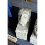 A large reconstituted stone human head corbal