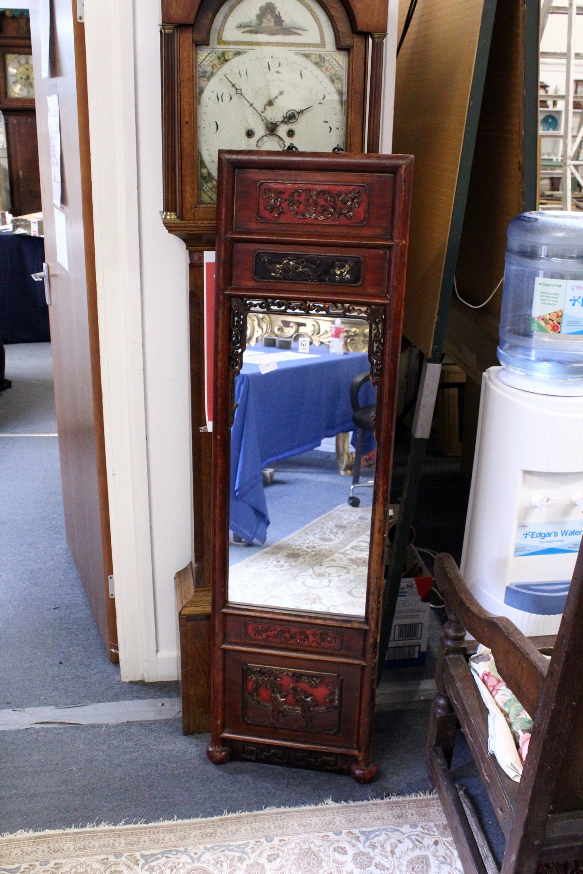 A Chinese dressing mirror with lacquer frame