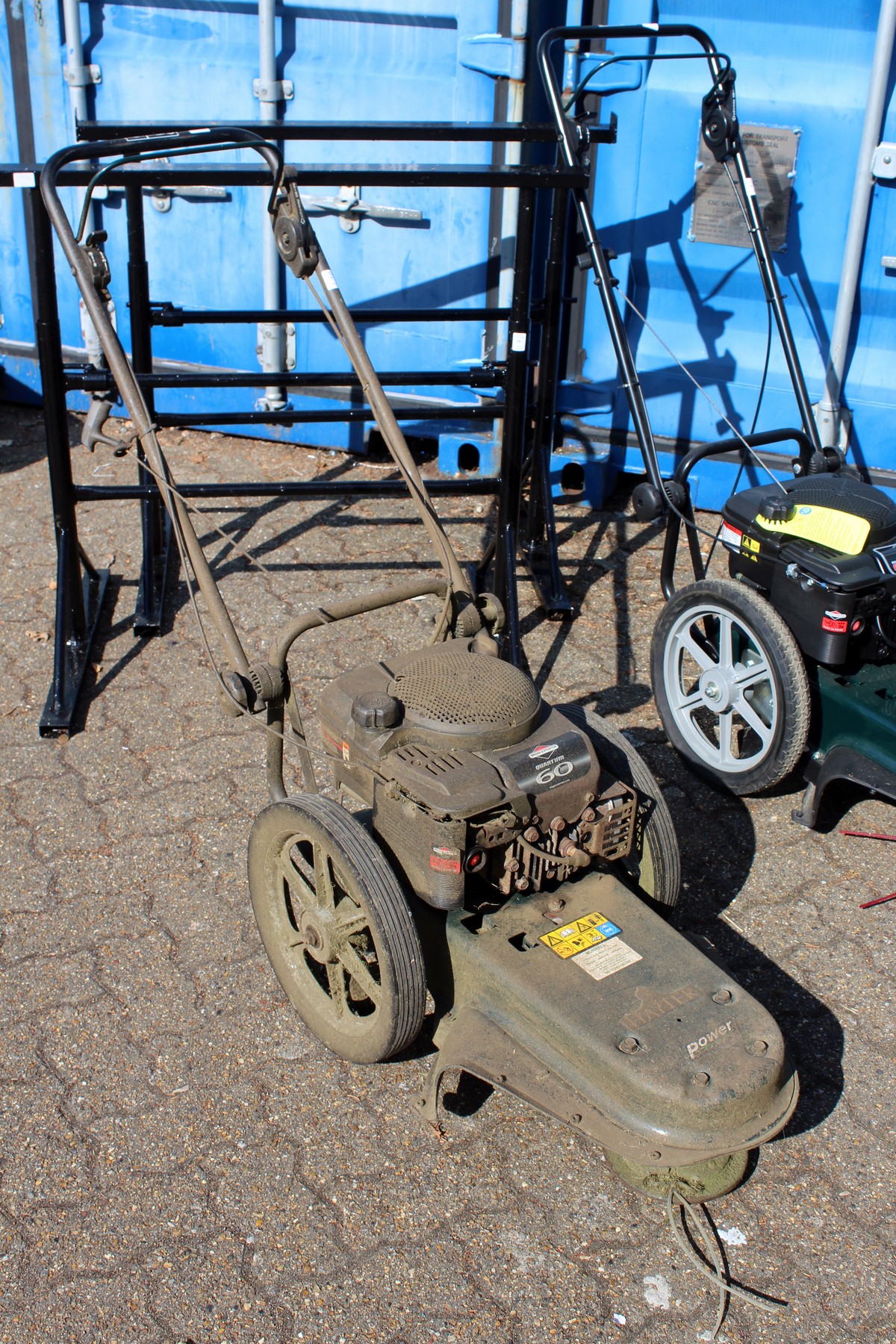 A Hayter Power Trim walk behind petrol strimmer