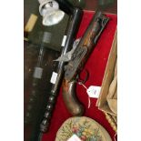 Collins of London a 19th century percussion pistol (hammer broken) together with a truncheon