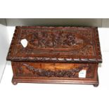 A carved oak casket