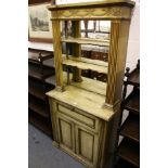 A 19th century carved and painted cabinet the upper section with mirror back and two shelves above a