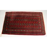 A modern red ground Bacara rug`