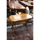 A good Victorian figured walnut foldover games table