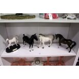 Four porcelain models of horses by Beswick and other makes