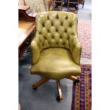 A leather upholstered office swivel armchair