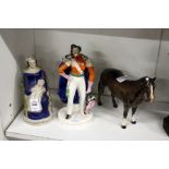 Two Staffordshire figures and a model of a horse