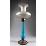 A blue opaque glass lamp with frosted shade