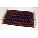 A blue ground Bokhara style rug