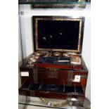 A 19th century ladies rosewood dressing case with part fitted interior