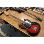 An unbranded short-scale electric bass guitar with zero fret and two single coils. Lacking knobs and