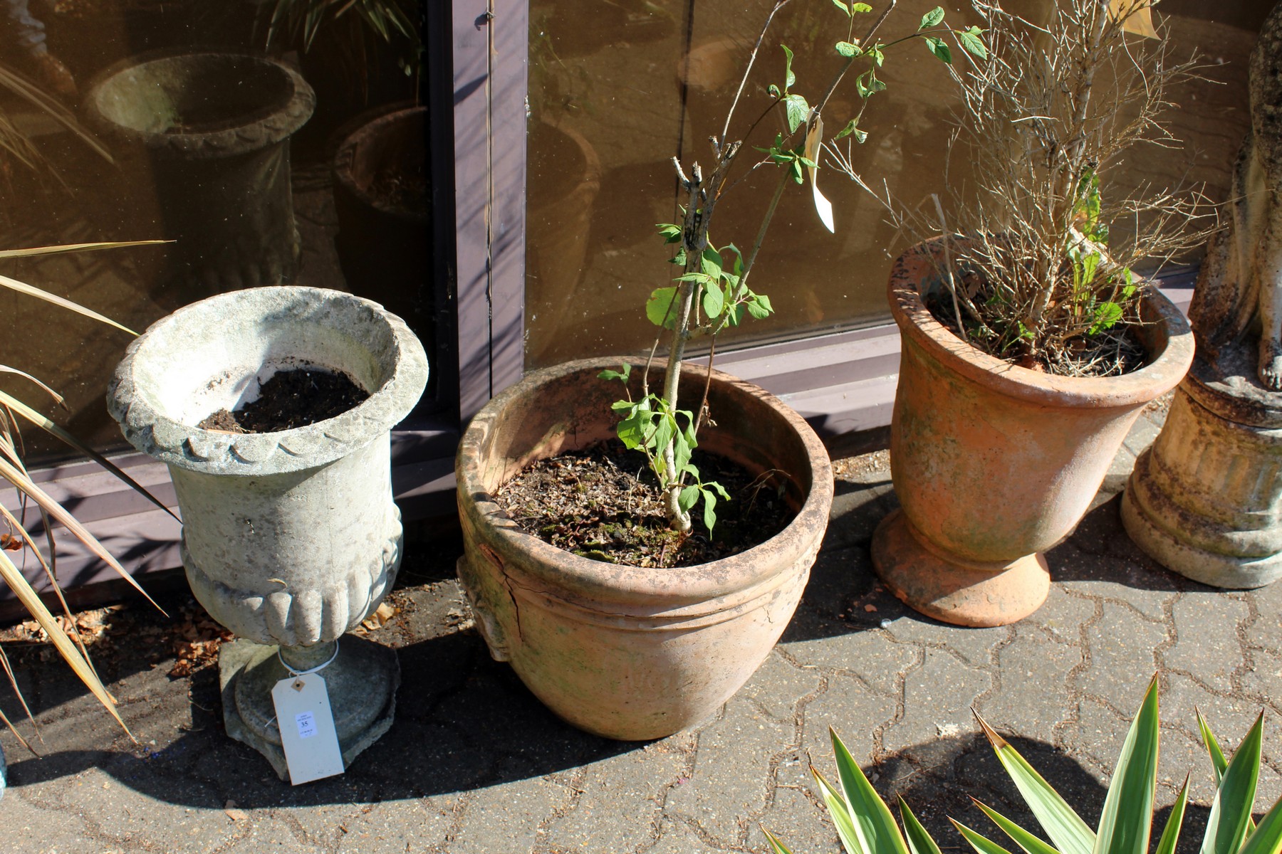 Three various garden pots (af)