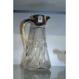 A silver mounted cut glass claret jug