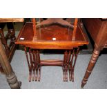 A mahogany nest of four tables