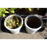 A pair of modern glazed terracotta large planters