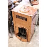 An unusual polished copper stove