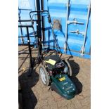 A Hayter Power Trim walk behind petrol strimmer (as new)