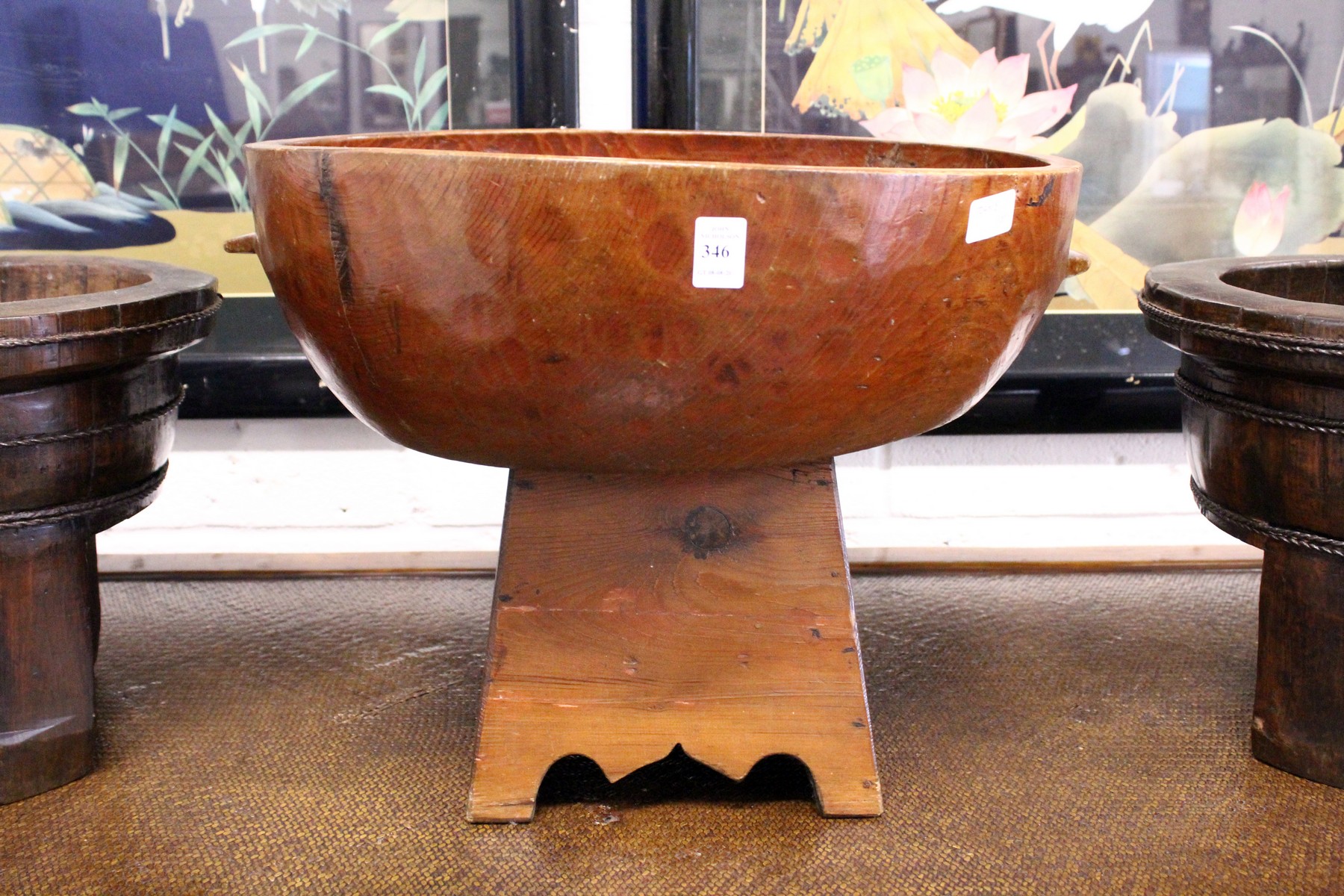 A Chinese carved wood circular pedestal bowl