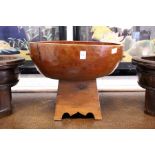 A Chinese carved wood circular pedestal bowl
