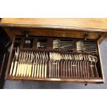 An oak cased floor standing two drawer part canteen of cutlery