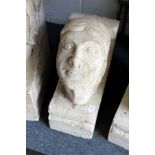 A large reconstituted stone human head corbal