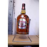 A 4.5 litre bottle of Chivas Regal Whiskey with pouring cradle
