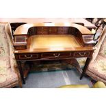 A reproduction mahogany and satinwood Carlton House desk