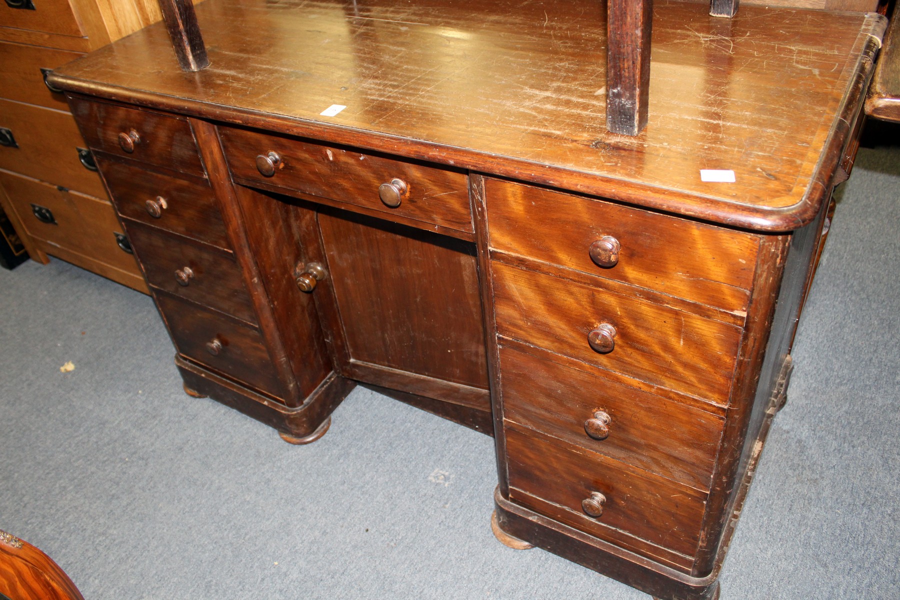 A Victorian mahogany stained pedestal desk or dressing table