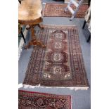 An early 20th century Persian rug rust ground with four central large medallions