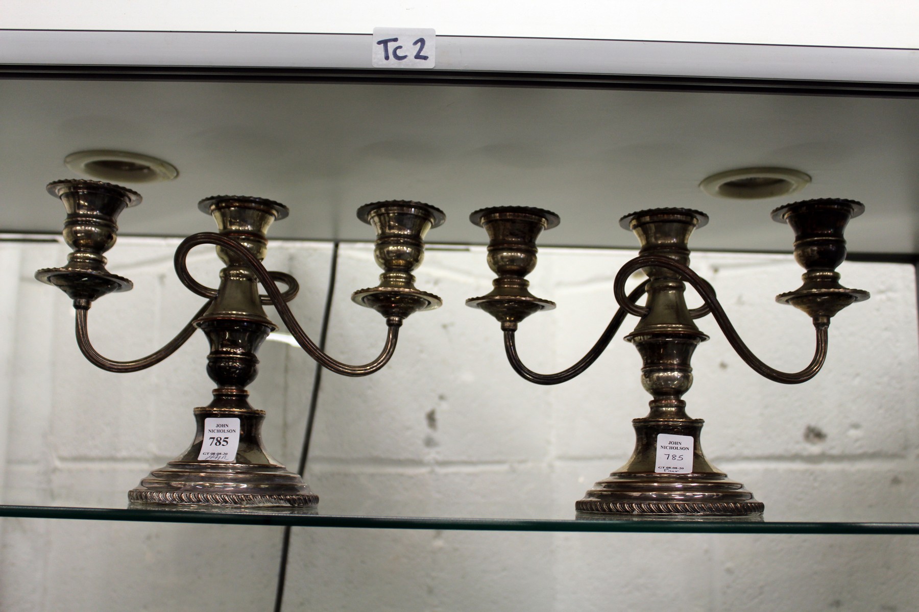 A pair of plated candelabra