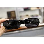 A cased pair of Chanel ladies sunglasses
