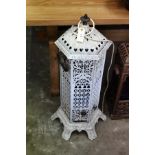 An old white painted cast iron conservatory heater