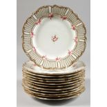 Twelve floral and gilt decorated plates