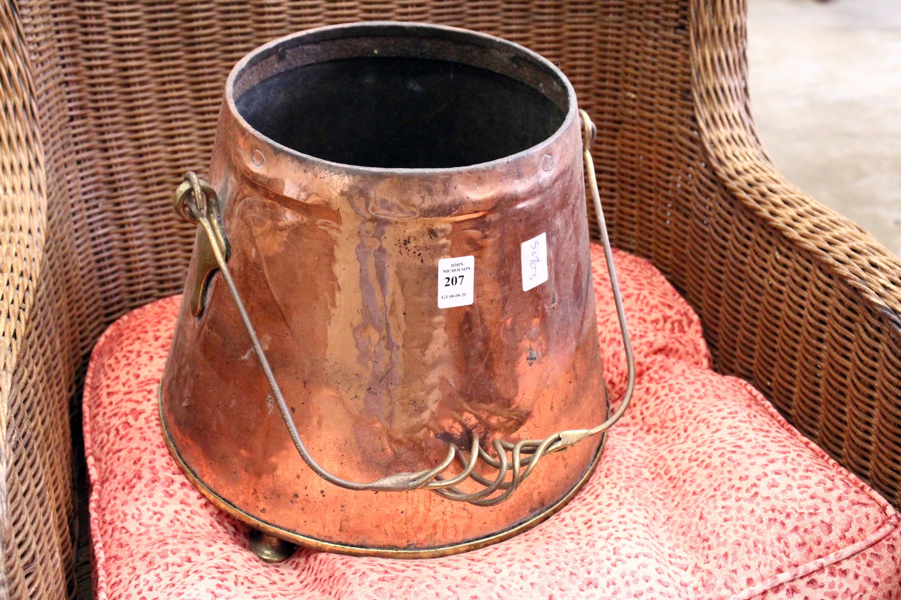 A copper and brass coal box