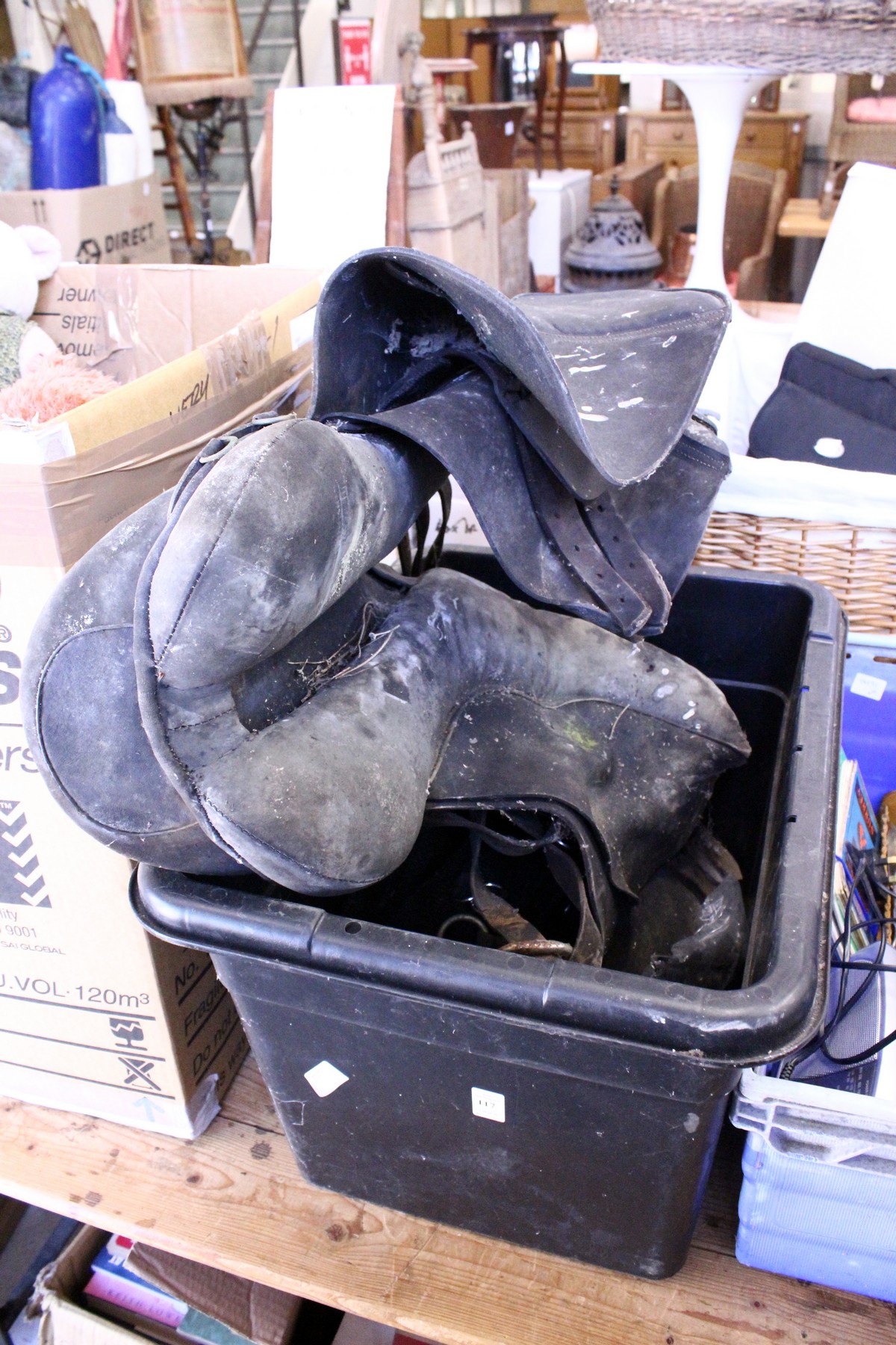 A leather horse saddle and similar equipment
