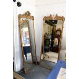 A pair of large gilt framed narrow mirrors (af)